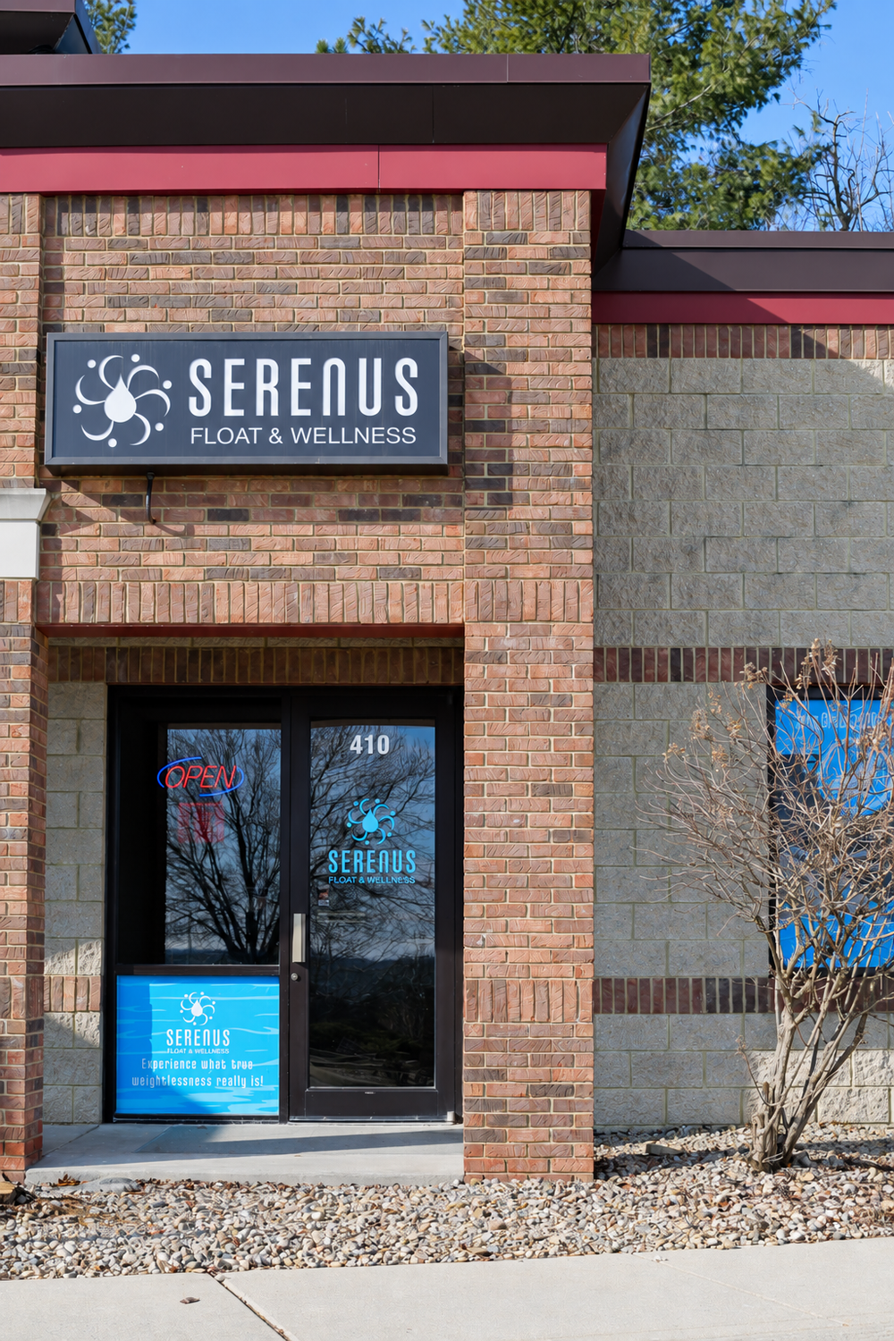 Serenus Float & Wellness sign and entrance at 410 South Landmark Avenue in Bloomington, Indiana